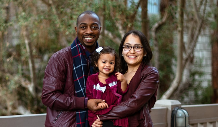 Stephanie and Muammar Reed with child