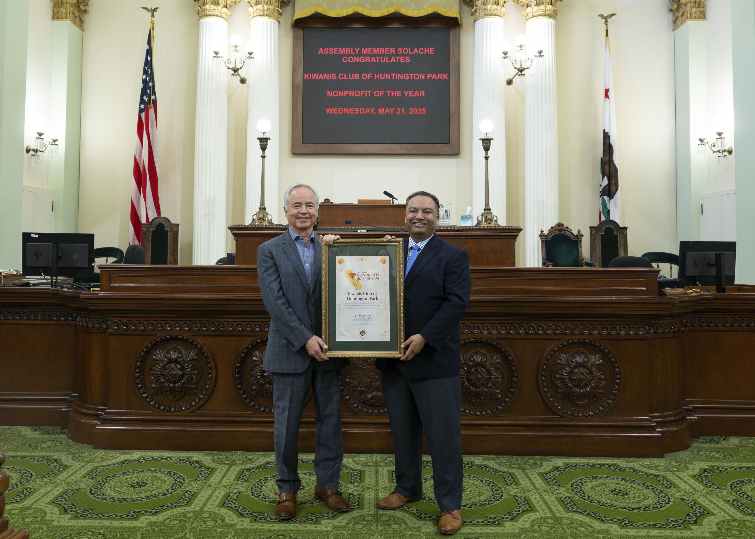 Asm. Solache presenting award to Kiwanis Club representative on the Assembly Floor