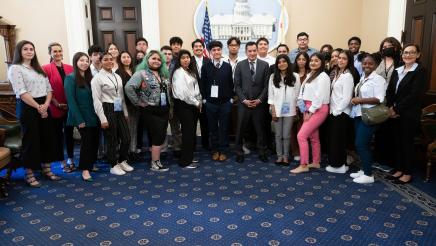 Group photo of Speaker Rendon, students and staff