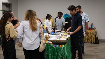 Students gathering around buffet tables