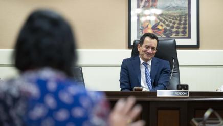 Speaker Emeritus Rendon smiles while listening to testimony from a witness