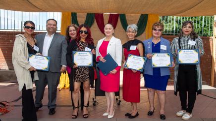 Group photo of honorees holding awards