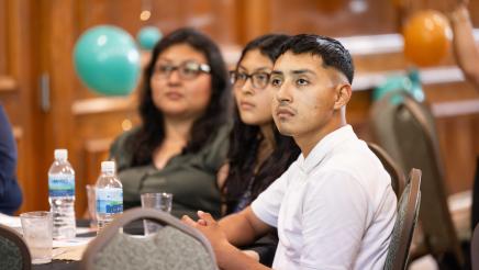 Seated program participants listening attentively