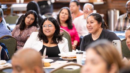 Seated program participants listening attentively