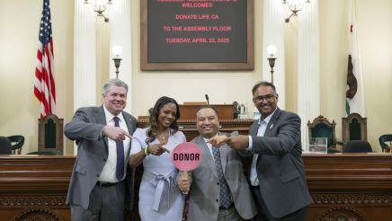Asm. Solache and other members displaying a donor sign
