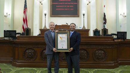 Asm. Solache presenting award to Kiwanis Club representative on the Assembly Floor
