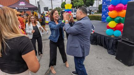 Asm. Solache high-fiving with attendee