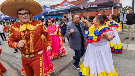 Asm. Solache dancing with dancers in traditional garb