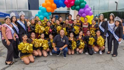 Group photo of Asm. Solache with drill team and pageant winners